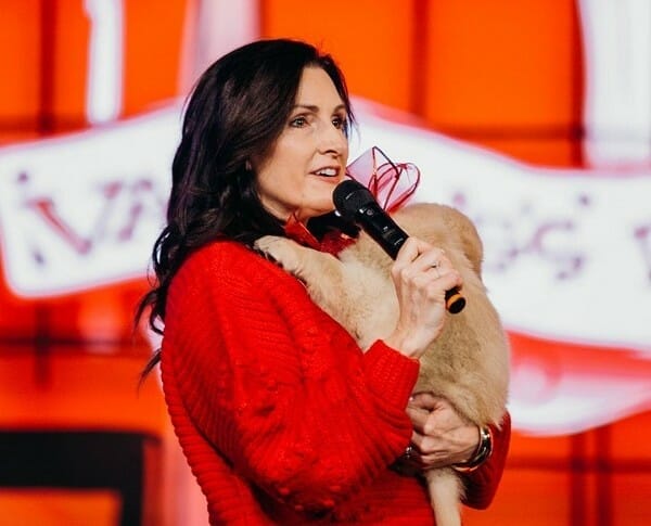 Becki Tilley in her red dress at the stage
