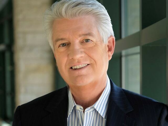 Jack Graham smiling in his black suit