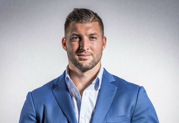 Tim Tebow looking great in his blue suit
