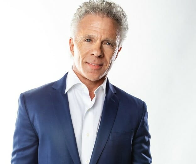 Kent Christmas looking bold in white shirt and blue suit