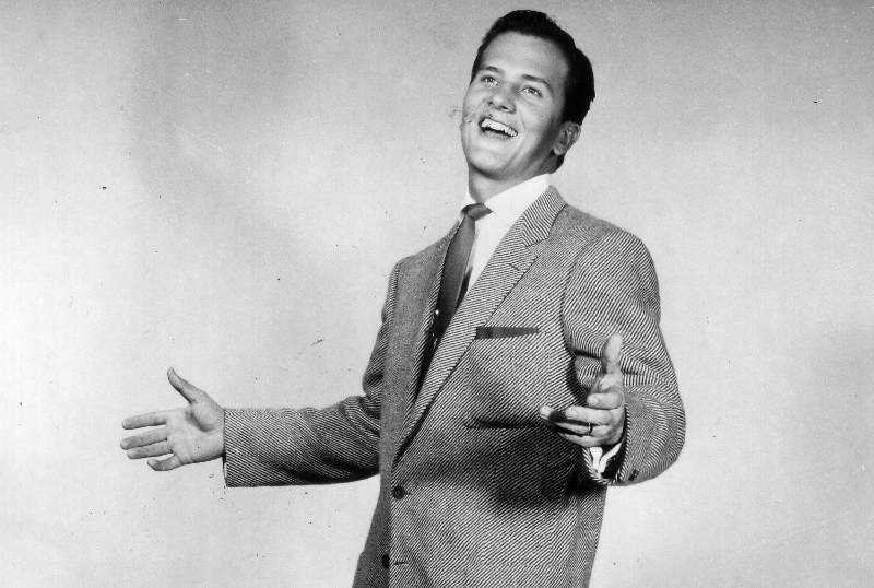 Images of a famous television personality and motivational speaker, Pat Boone