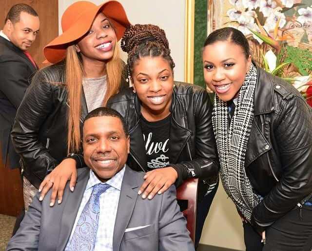 Creflo Dollar looking happy with his children