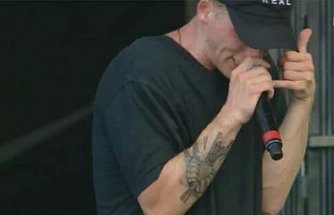 Christian Rapper NF Tattoos on his arm